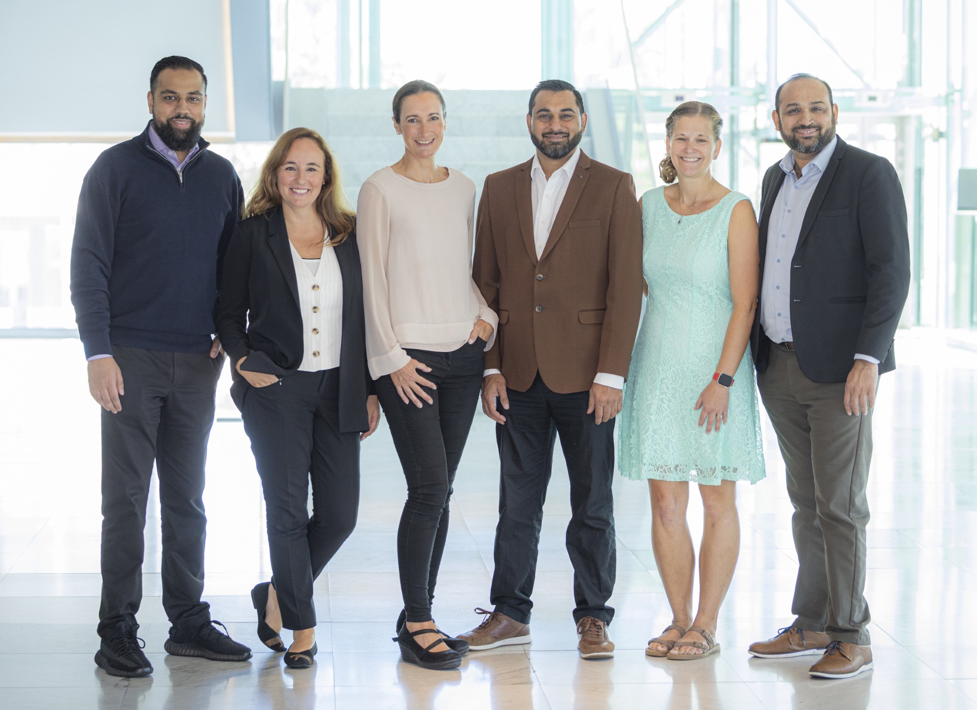 Technician examining a patient's vision using a slit lamp